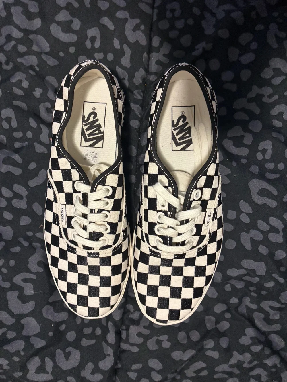 Vans Black and White Checkerboard Slip-On Sneakers